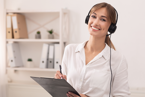 Woman wearing headset with clipboard