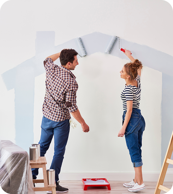 Young couple painting their home